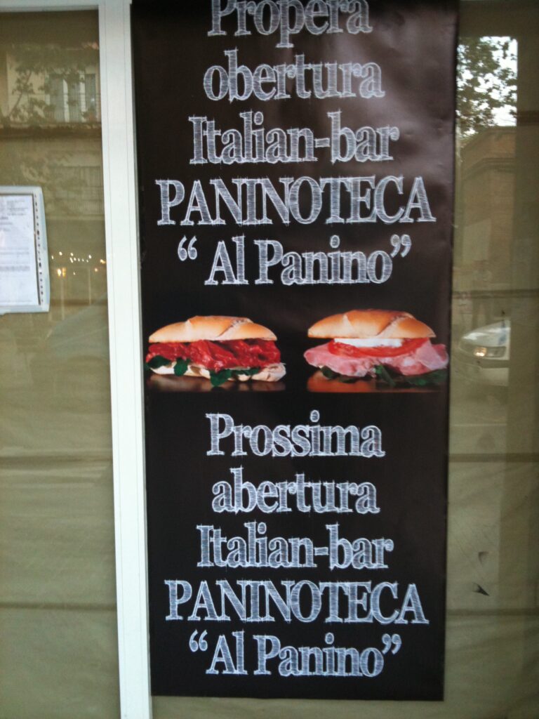 Cartell «Propera obertura» de la paninoteca Al Panino